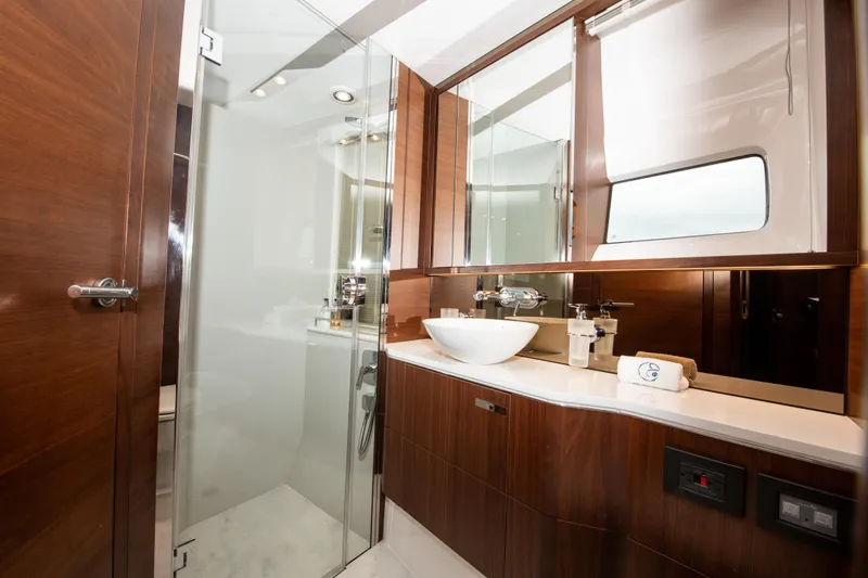 Slide: The Image of Luxurious bathroom in 2018 Princess S60 yacht with modern fixtures and wooden cabinetry. - 10