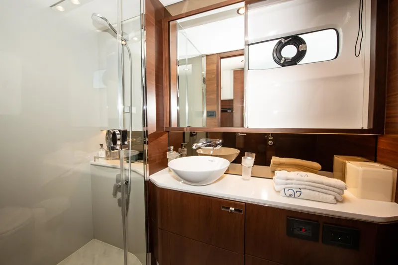 Slide: The Image of Luxurious bathroom in 2018 Princess S60 yacht with modern fixtures and elegant wood accents. - 12