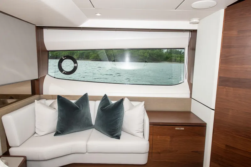 Slide: The Image of Luxurious interior of 2018 Princess S60 yacht with elegant seating and scenic window view. - 13