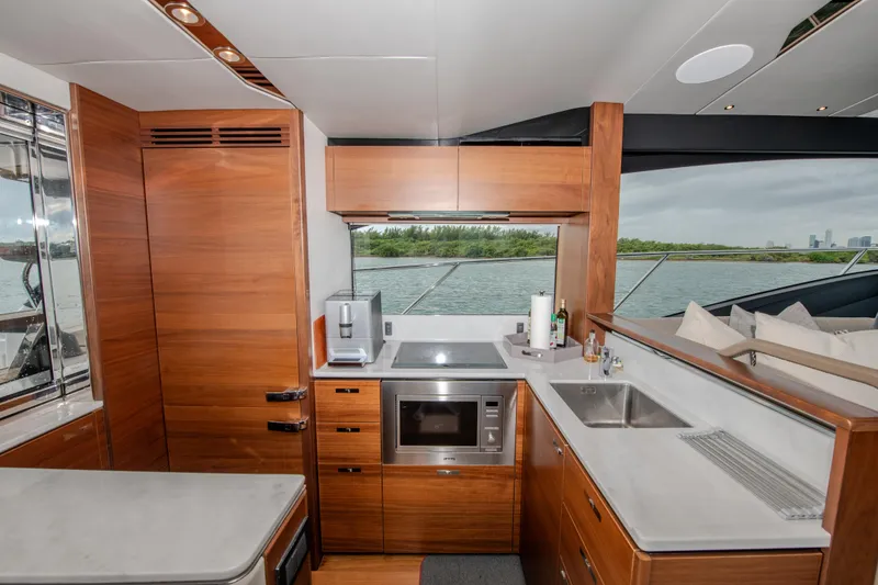Slide: The Image of Luxurious kitchen interior of 2018 Princess S60 yacht with modern appliances and wood finish. - 18