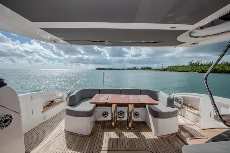 Slide: The Image of Luxurious 2018 Princess S60 yacht deck with seating, overlooking serene ocean view. - 22