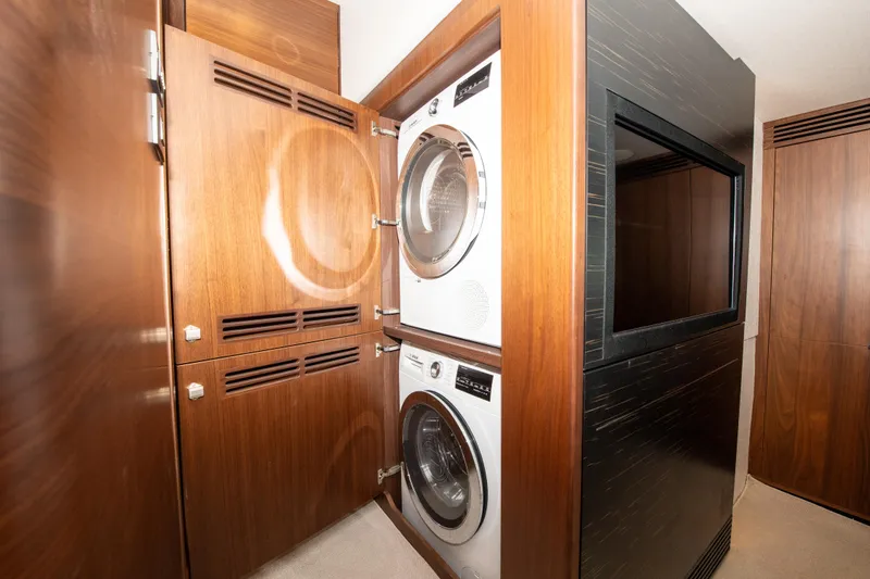 Slide: The Image of Laundry area with stacked washer and dryer in 2018 Princess S60 yacht. - 8