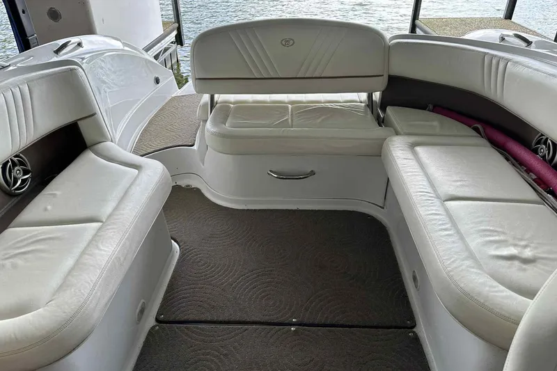 Slide: The Image of Interior of 2008 Cobalt 252 boat with white leather seating and carpeted floor. - 10