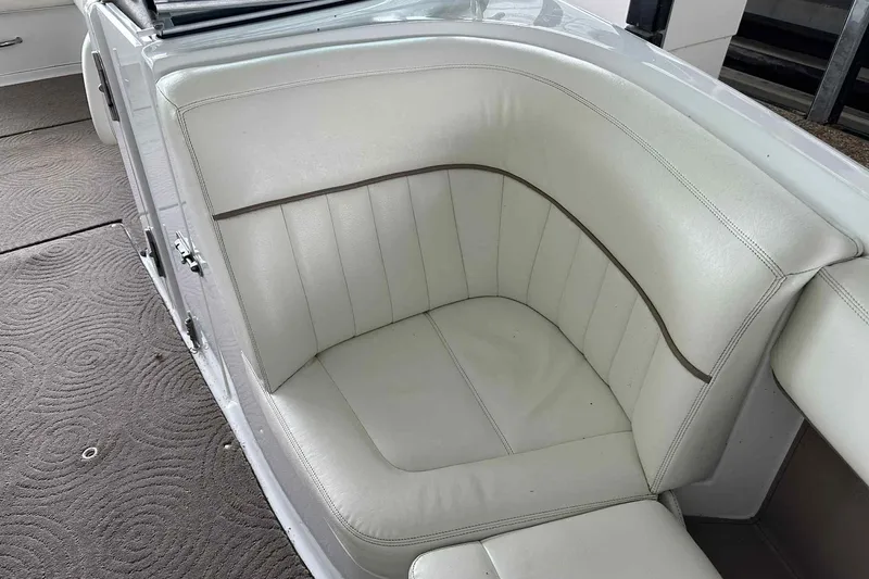 Slide: The Image of 2008 Cobalt 252 boat interior with white leather seating. - 12