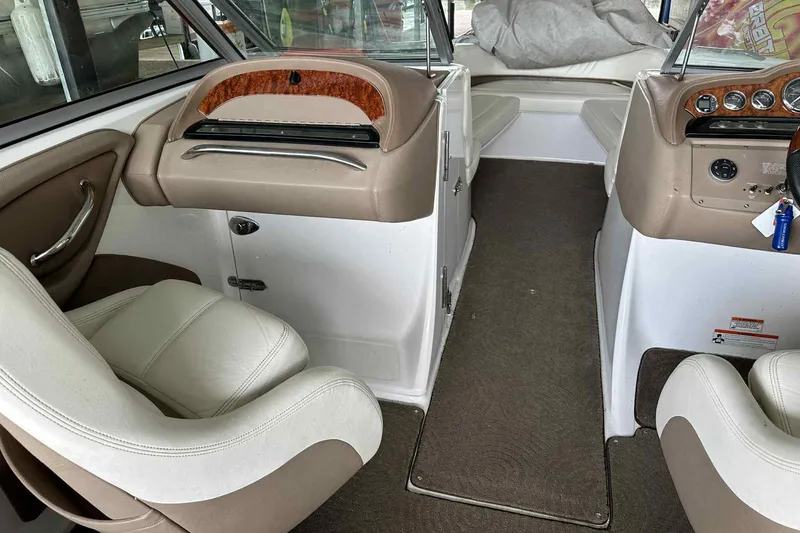 Slide: The Image of Interior of a 2008 Cobalt 252 boat with beige and white seating. - 14
