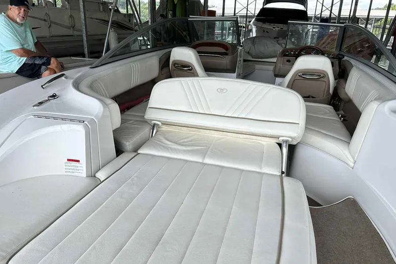 Slide: The Image of 2008 Cobalt 252 boat interior with white leather seating and spacious layout. - 16