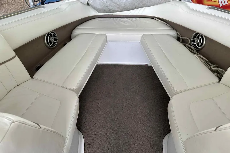 Slide: The Image of Interior of a 2008 Cobalt 252 boat with beige seating and carpet. - 20