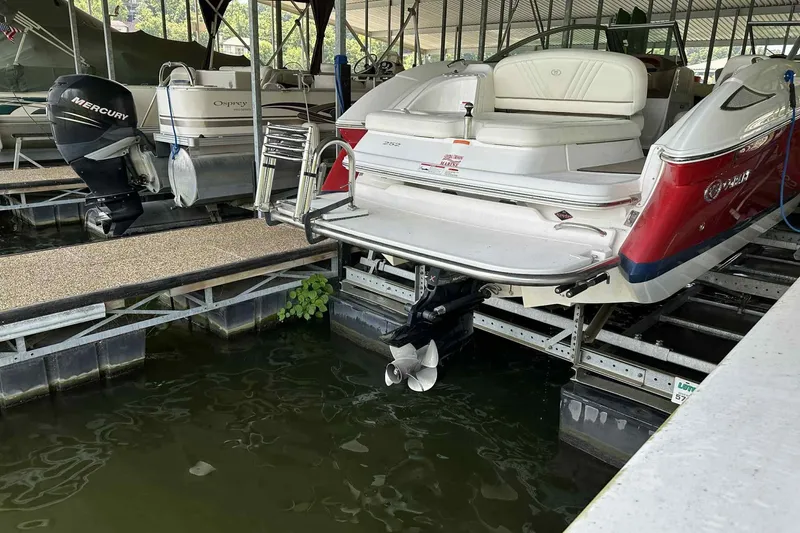 Slide: The Image of 2008 Cobalt 252 boat docked in marina, featuring sleek design and powerful engine. - 21