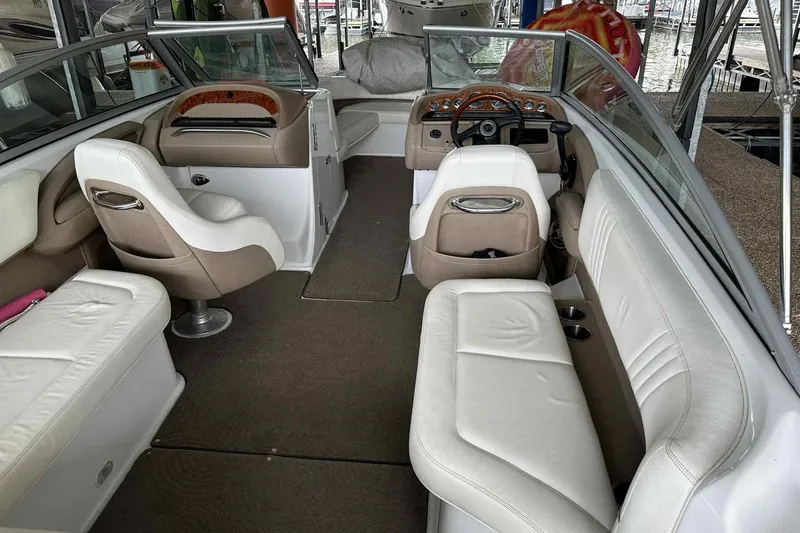 Slide: The Image of Interior of a 2008 Cobalt 252 boat with white and beige seating. - 28