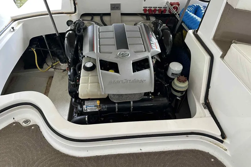 Slide: The Image of Engine compartment of a 2008 Cobalt 252 boat featuring a MerCruiser engine. - 29