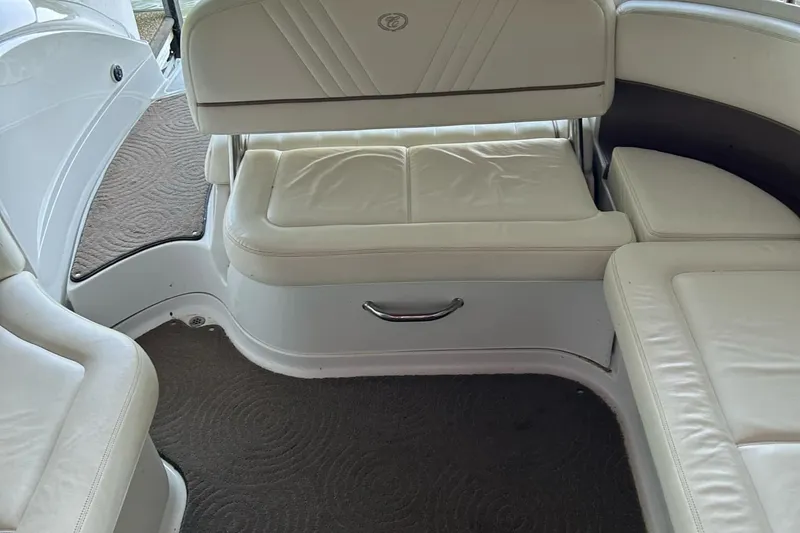 Slide: The Image of Interior seating of a 2008 Cobalt 252 boat with white upholstery. - 3