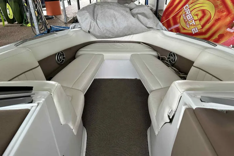 Slide: The Image of Interior of a 2008 Cobalt 252 boat with white leather seating. - 9