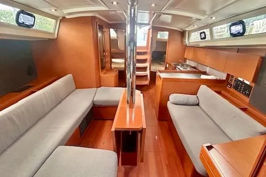 Slide: The Image of Interior of 2017 Beneteau Oceanis 41.1 yacht with modern wood finish and seating. - 10