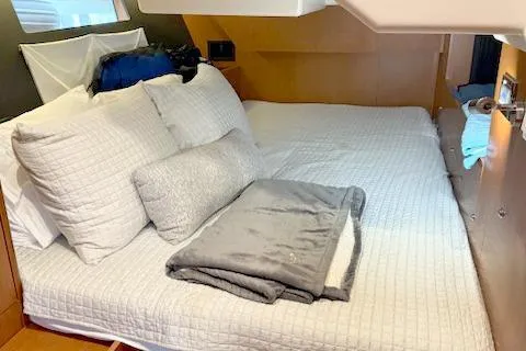 Slide: The Image of 2017 Beneteau Oceanis 41.1 cabin interior with cozy bedding and modern design. - 17