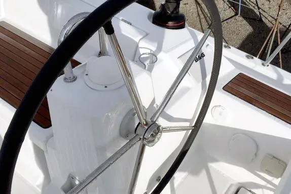 Slide: The Image of Steering wheel of a 2017 Beneteau Oceanis 41.1 sailboat with teak accents. - 4