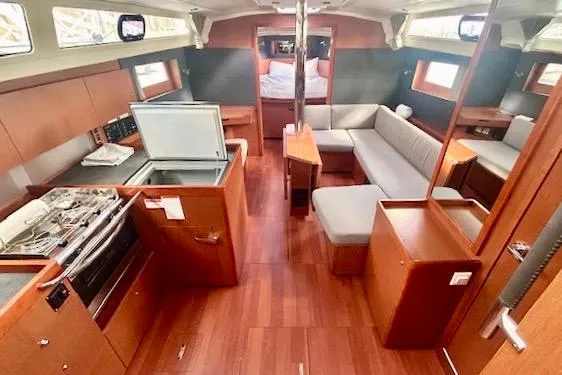 Slide: The Image of Interior of 2017 Beneteau Oceanis 41.1 yacht with modern kitchen and seating area. - 9