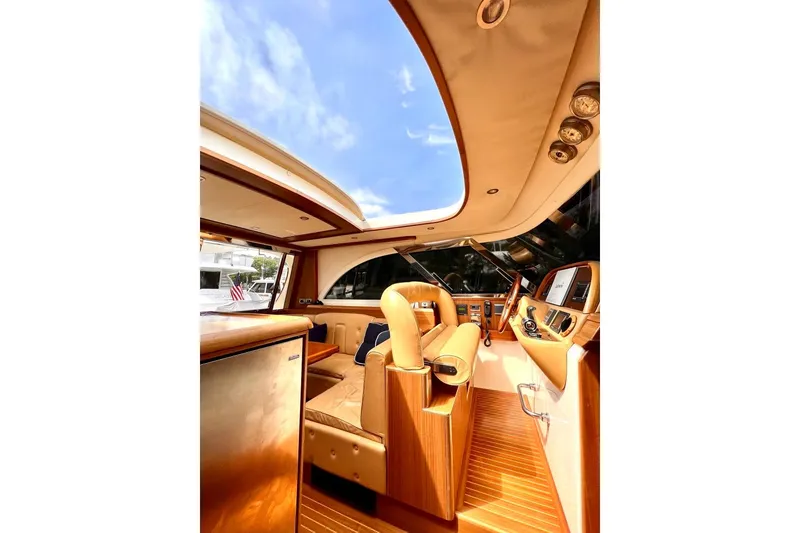 Slide: The Image of Luxurious interior of 2006 Mochi Craft 51 Dolphin yacht with elegant wood and leather finishes. - 18