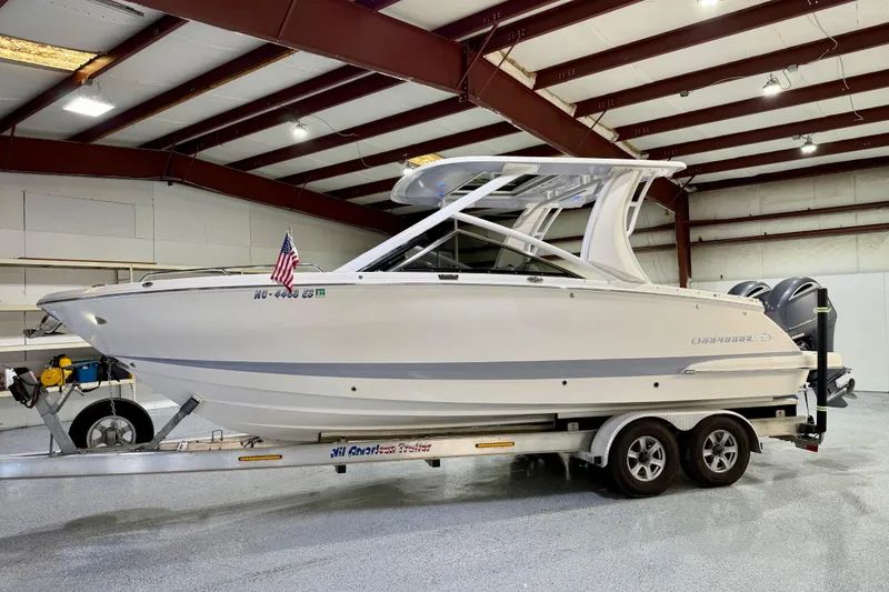 Slide: The Image of 2021 Chaparral 280 OSX boat on trailer in indoor storage facility. - 10