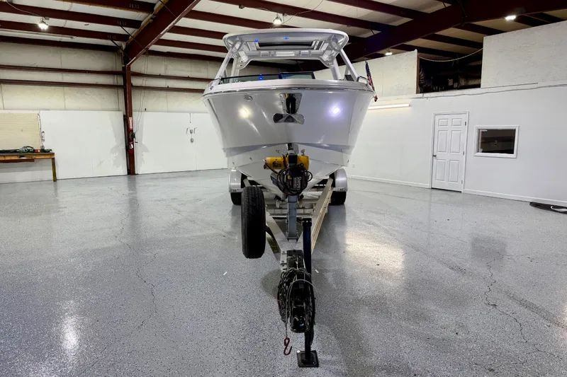 Slide: The Image of 2021 Chaparral 280 OSX boat on trailer in spacious indoor garage. - 12