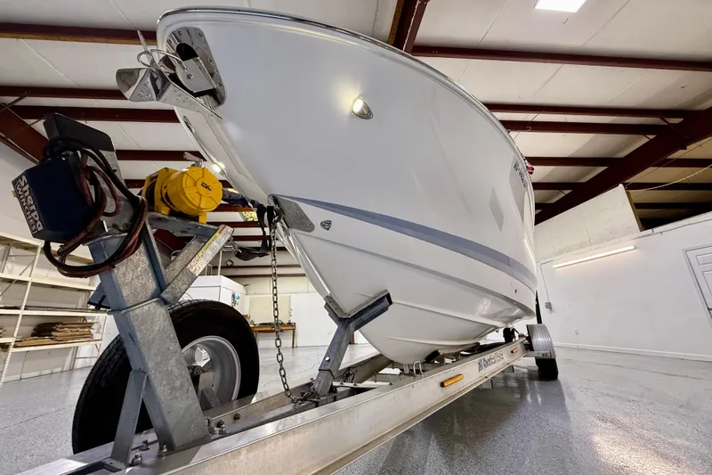 Slide: The Image of 2021 Chaparral 280 OSX boat on trailer in indoor storage facility. - 13