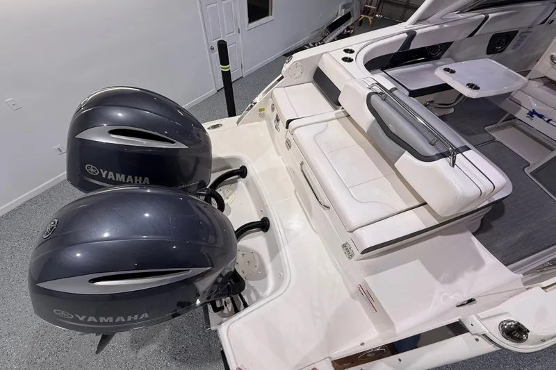 Slide: The Image of 2021 Chaparral 280 OSX boat with dual Yamaha engines and spacious seating area. - 15