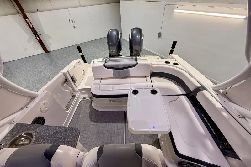 Slide: The Image of 2021 Chaparral 280 OSX boat interior with seating and dual outboard engines. - 27