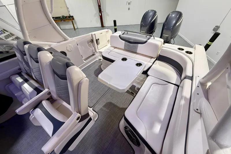 Slide: The Image of 2021 Chaparral 280 OSX boat interior with seating and dual outboard engines. - 28