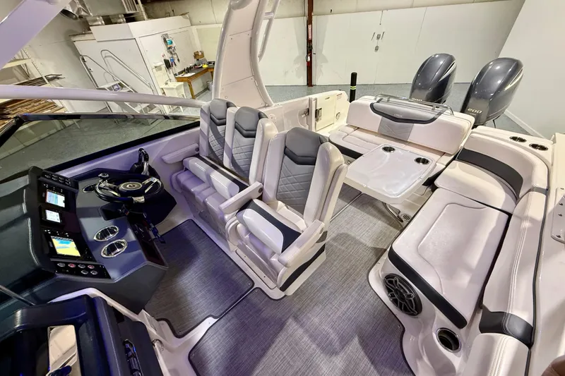 Slide: The Image of 2021 Chaparral 280 OSX boat interior with modern seating and dual engines. - 29