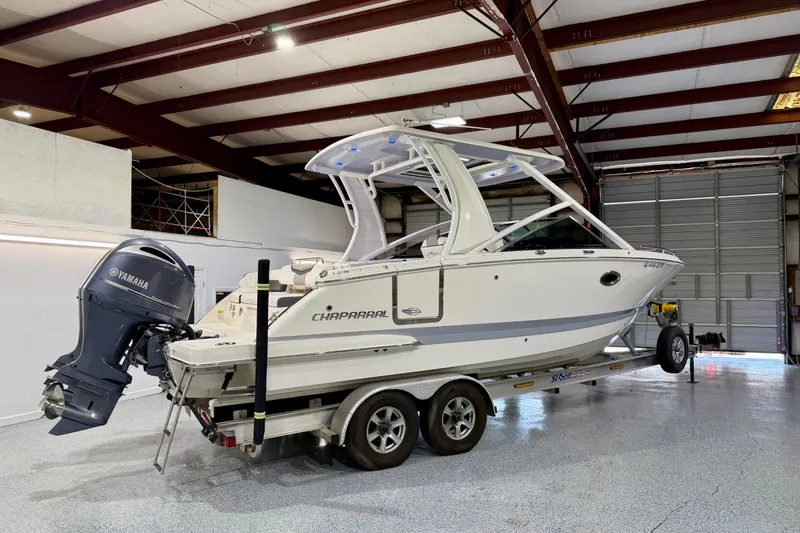 Slide: The Image of 2021 Chaparral 280 OSX boat with Yamaha engine on trailer in indoor storage. - 3