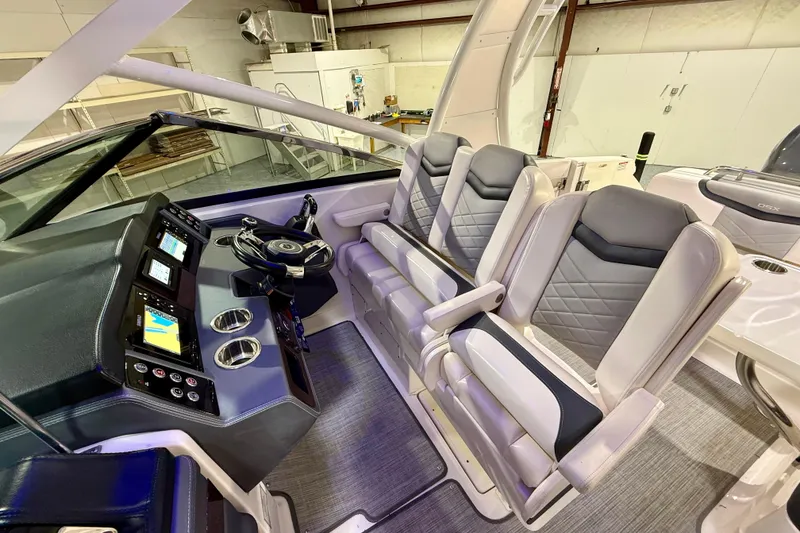Slide: The Image of 2021 Chaparral 280 OSX boat interior with modern helm and luxurious seating. - 31