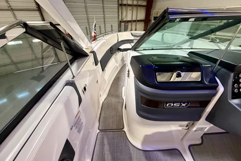 Slide: The Image of 2021 Chaparral 280 OSX boat interior with sleek design and modern dashboard. - 36