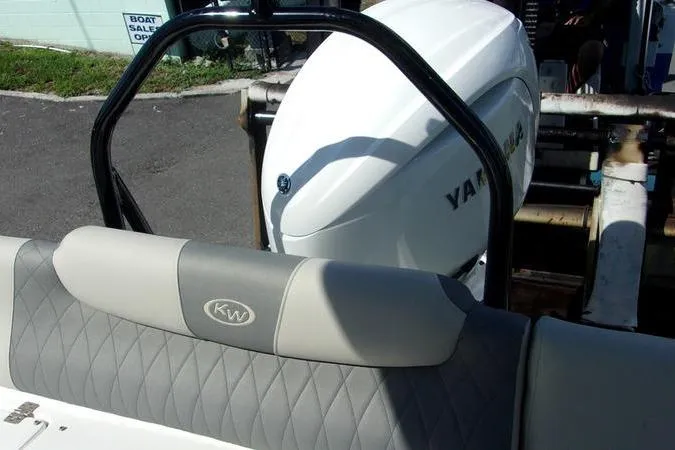 Slide: The Image of 2025 Key West 219 FS boat with Yamaha engine, featuring quilted seating. - 10