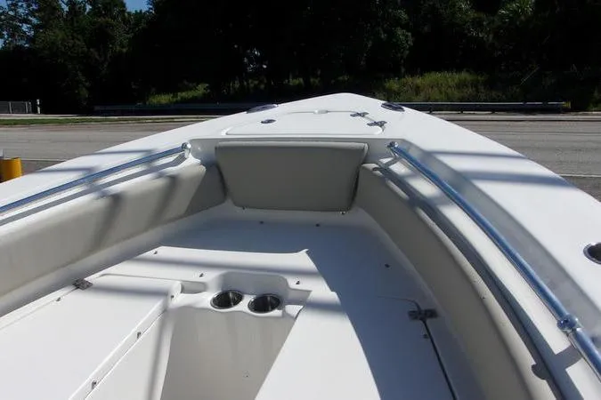 Slide: The Image of 2025 Key West 219 FS boat interior with seating and cup holders. - 12