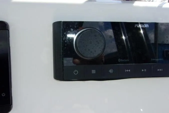 Slide: The Image of Control panel on 2025 Key West 219 FS boat, featuring Fusion audio system. - 13