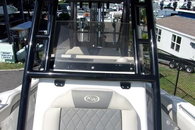Slide: The Image of 2025 Key West 219 FS boat with cushioned seating and sturdy frame. - 14