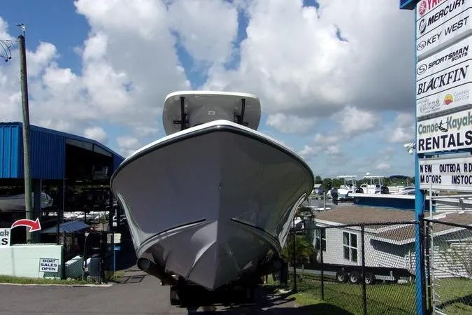 Slide: The Image of 2025 Key West 219 FS boat displayed outdoors under a cloudy sky. - 3