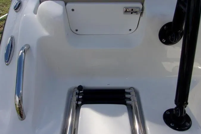Slide: The Image of 2025 Key West 219 FS boat ladder and storage compartment detail. - 4