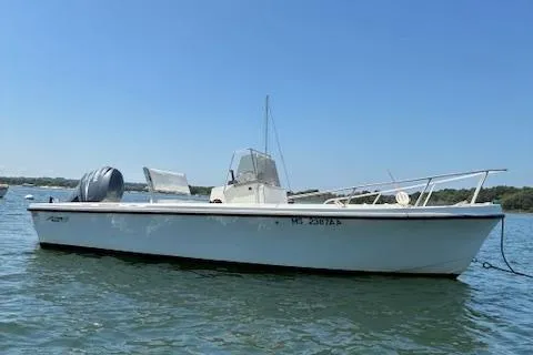 The Image of 1989 Mako 191CC boat on water under clear blue sky. - 0