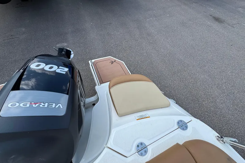 Slide: The Image of 2014 Sea Ray 220 Sundeck Outboard with Verado 200 engine, rear seating view. - 10