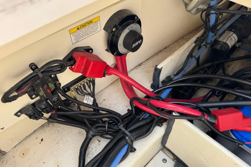 Slide: The Image of Electrical wiring and components in a 2014 Sea Ray 220 Sundeck Outboard boat. - 24