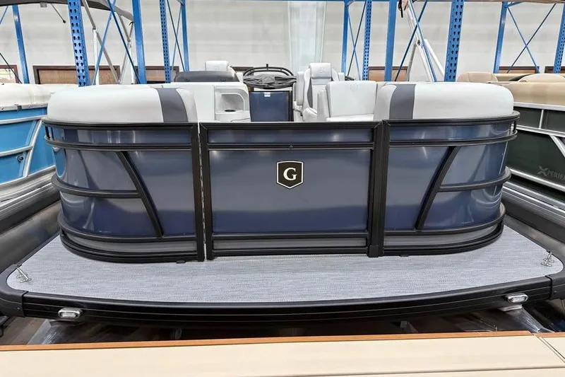 Slide: The Image of 2026 Godfrey SWEETWATER 2286 SB pontoon boat in showroom, featuring sleek design and comfortable seating. - 0