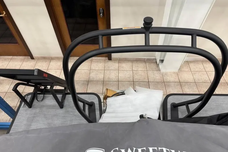 Slide: The Image of 2026 Godfrey SWEETWATER 2286 SB boat interior with railing and tiled floor. - 11