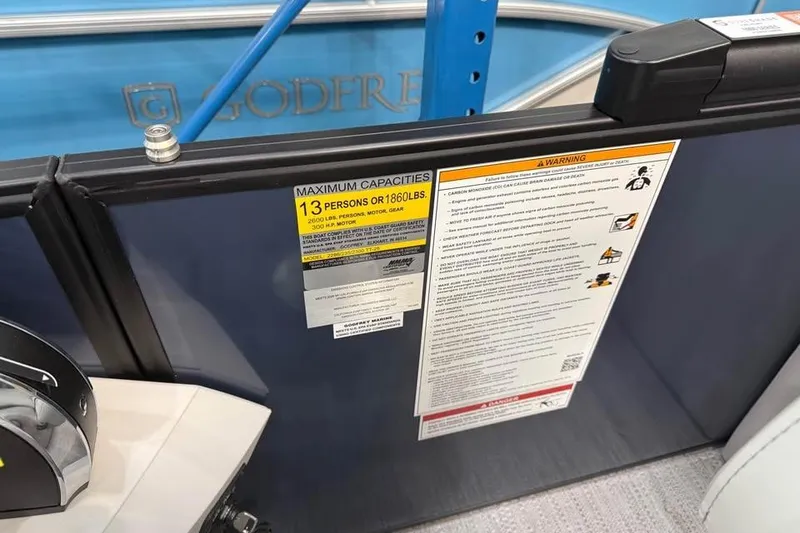 Slide: The Image of 2026 Godfrey SWEETWATER 2286 SB boat capacity label, maximum 13 persons or 1860 lbs. - 12