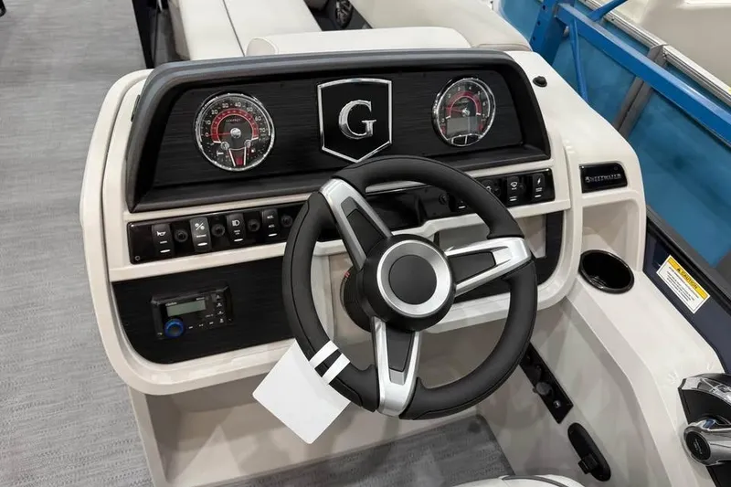 Slide: The Image of Steering console of 2026 Godfrey SWEETWATER 2286 SB boat with modern controls and gauges. - 7