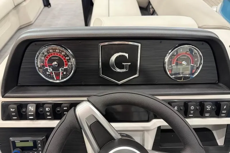 Slide: The Image of Dashboard of 2026 Godfrey SWEETWATER 2286 SB boat with steering wheel and gauges. - 8