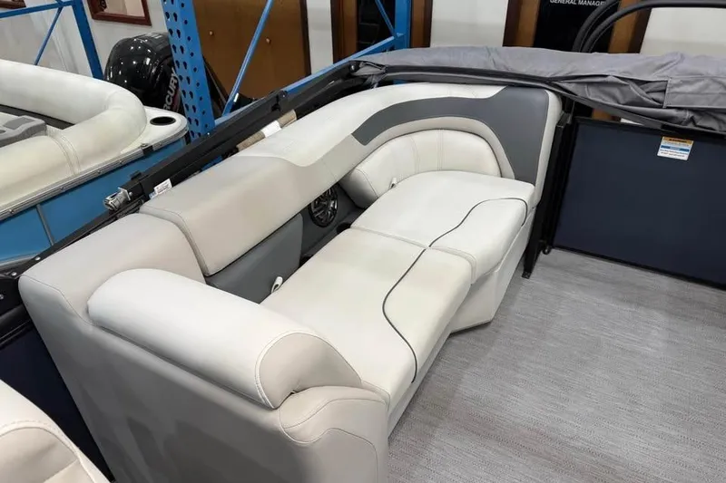 Slide: The Image of 2026 Godfrey SWEETWATER 2286 SB boat interior with plush seating and modern design. - 9