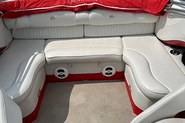Slide: The Image of 2006 Crownline 266 boat interior with white and red seating, featuring built-in speakers. - 4