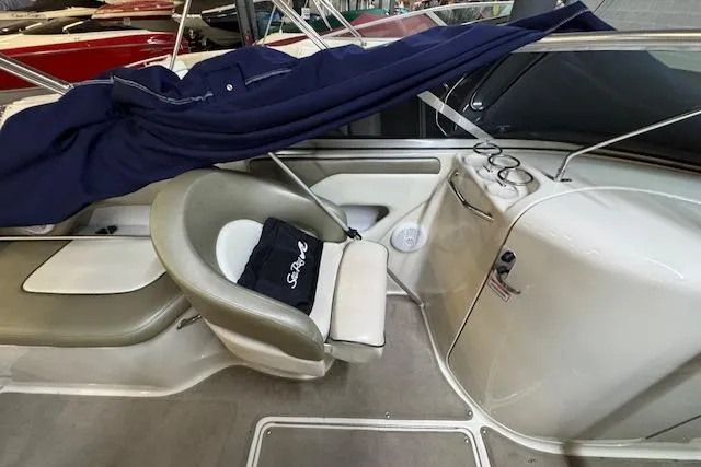 Slide: The Image of Interior of a 2006 Sea Ray SDX 270 boat with seating and cover. - 5