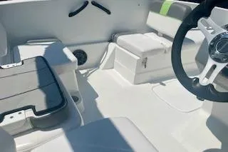 Slide: The Image of Interior of a 2021 Tahoe T16 boat featuring seating and steering wheel. - 10