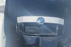 Slide: The Image of 2021 Tahoe T16 boat engine cover with sleek design and logo. - 9